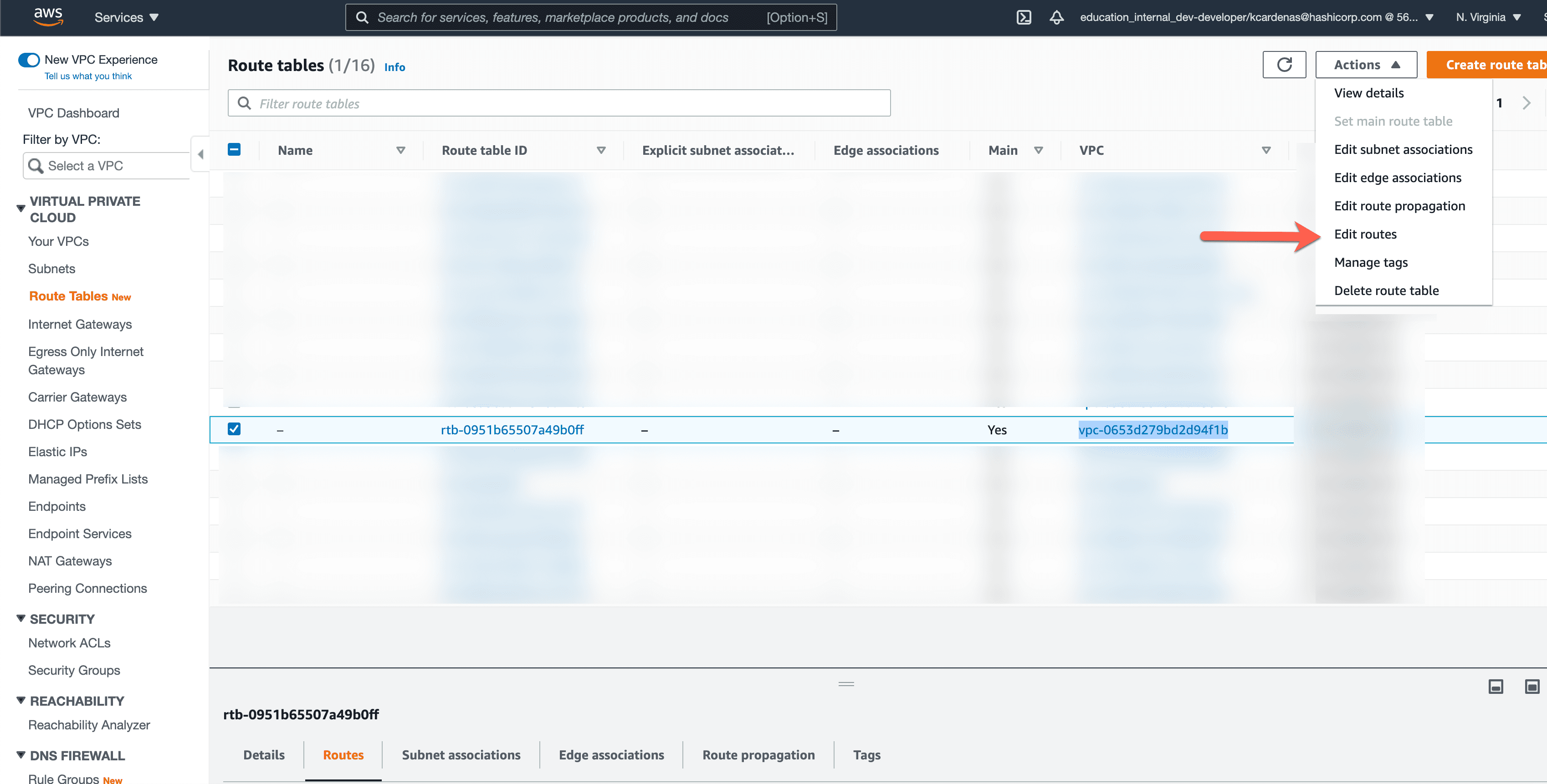 AWS Console view that displays all VPC and their respective route tables. An arrow is pointing to the actions button